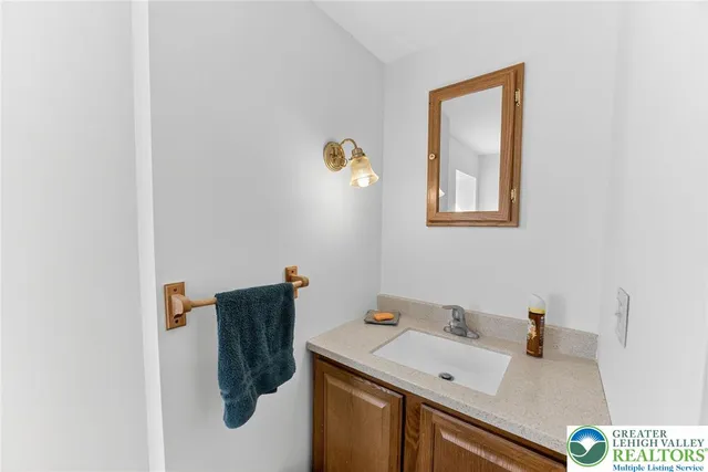 a bathroom with a sink and mirror