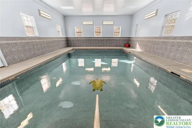 a view of a living room and kitchen floor to ceiling window and kitchen view