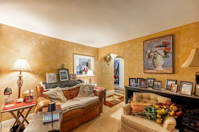 a bathroom with a sink a toilet and shower curtain