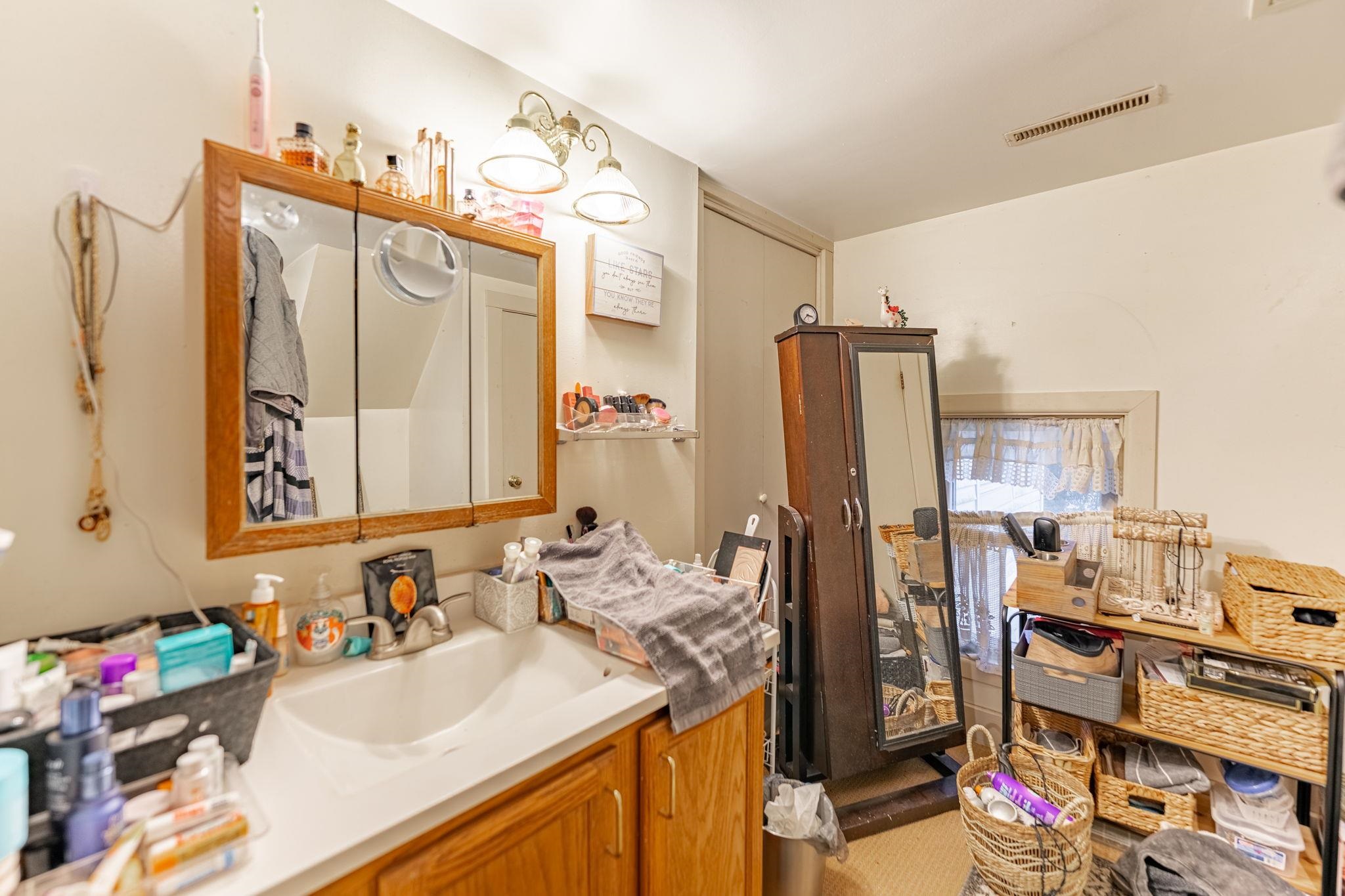 917 West Locust Street Belvidere, IL 61008 - Photo 22 of 59 a bathroom with a sink double vanity and a mirror