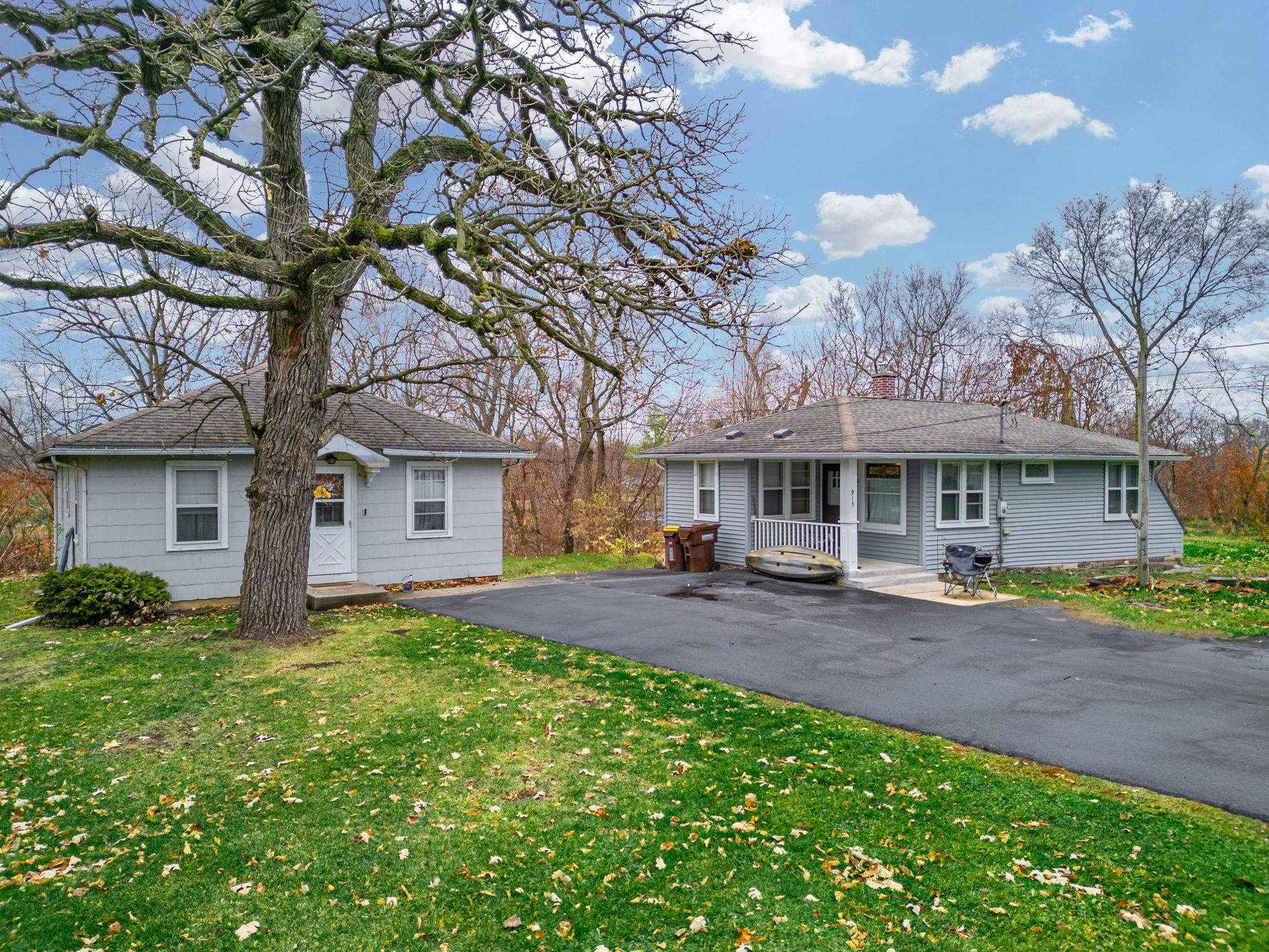 917 West Locust Street Belvidere, IL 61008 - Photo 50 of 59 a front view of a house with a garden and trees