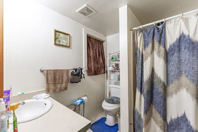 a bathroom with a sink double vanity and a mirror