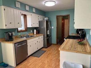 2433 Flat Rock Road Dyer, IN 46311 - Photo 4 of 17 a kitchen with granite countertop a sink stove and refrigerator