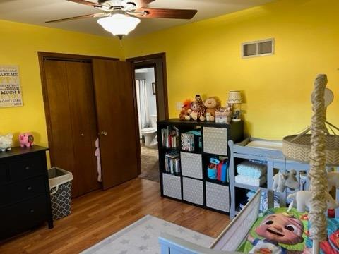 2433 Flat Rock Road Dyer, IN 46311 - Photo 9 of 17 a bedroom with a bed and wooden floor