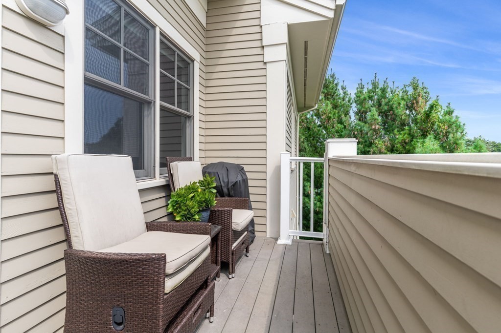 39 Intrepid Circle, Unit 302 Marblehead, MA 01945 - Photo 5 of 32 a view of balcony with furniture and a potted plant
