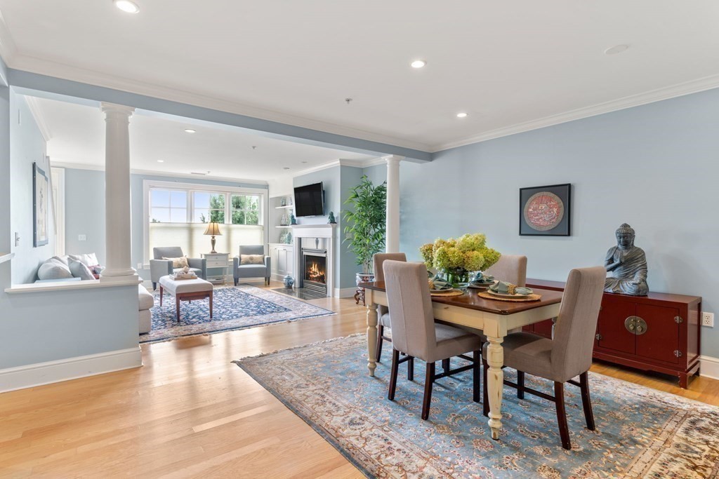 39 Intrepid Circle, Unit 302 Marblehead, MA 01945 - Photo 7 of 32 a view of a dining room with furniture window and wooden floor