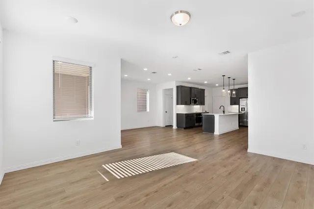 a view of kitchen with cabinets and wooden floor