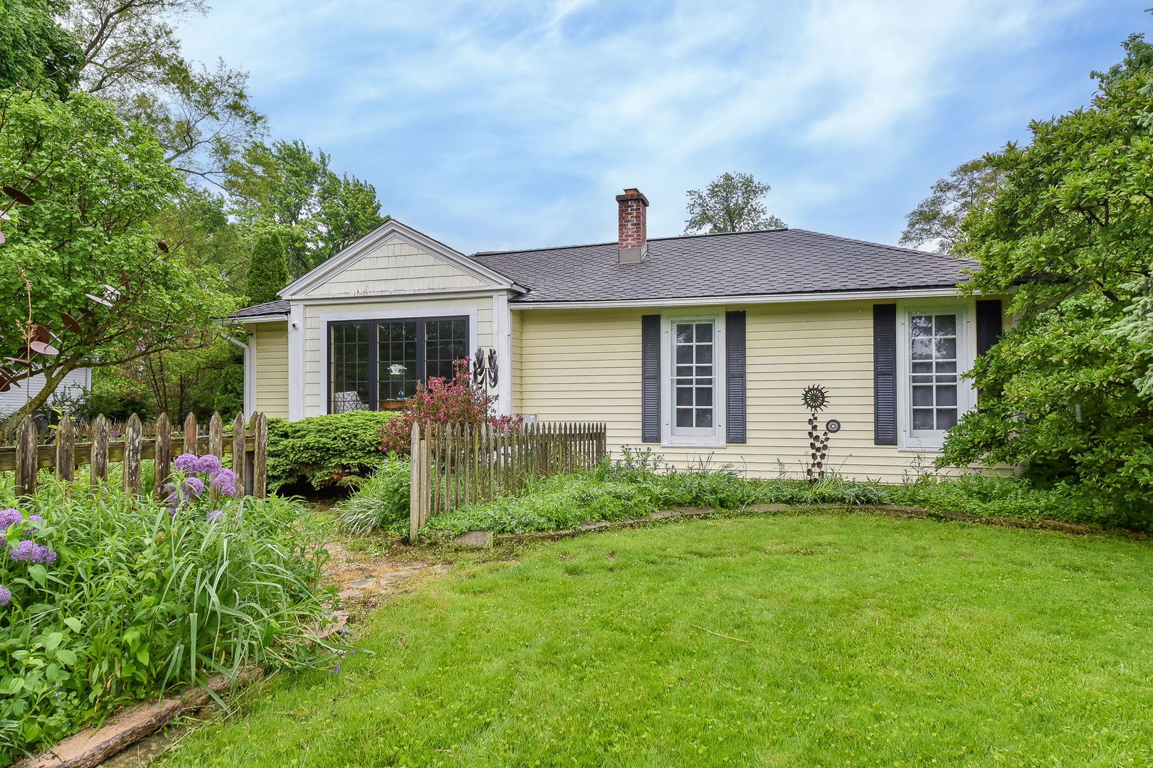 27W355 Mack Road Wheaton, IL 60189 - Photo 1 of 22 a front view of house with yard and green space