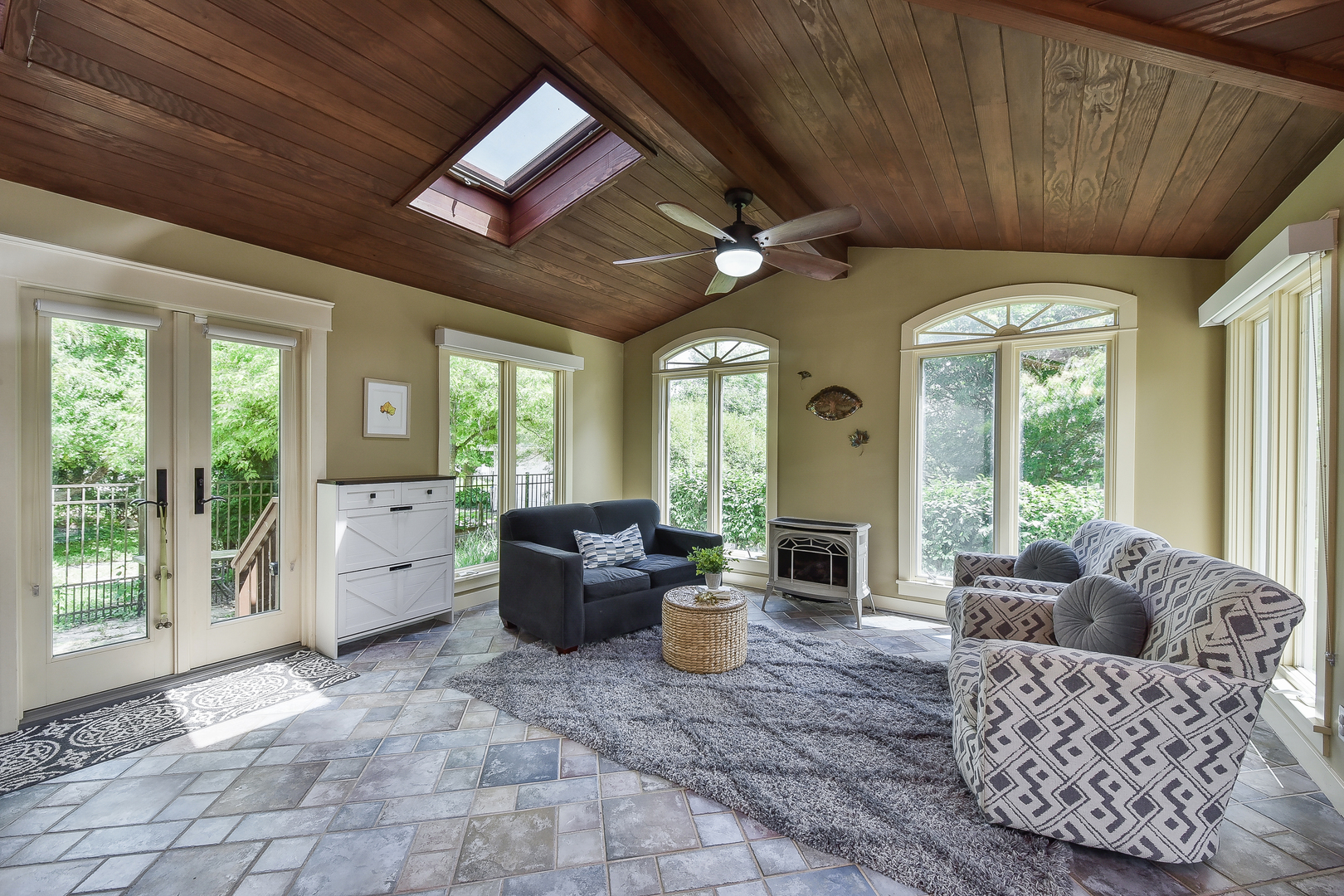 27W355 Mack Road Wheaton, IL 60189 - Photo 11 of 22 a living room with furniture large window furniture and a fireplace