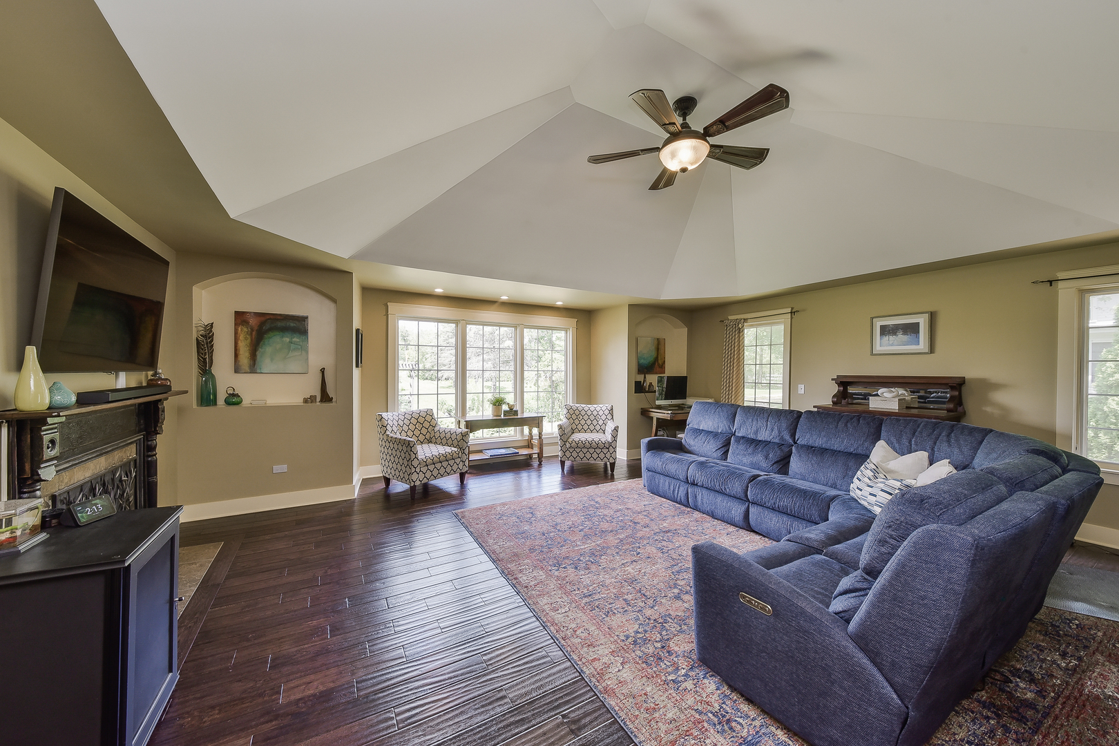 27W355 Mack Road Wheaton, IL 60189 - Photo 12 of 22 a living room with furniture a ceiling fan and a window