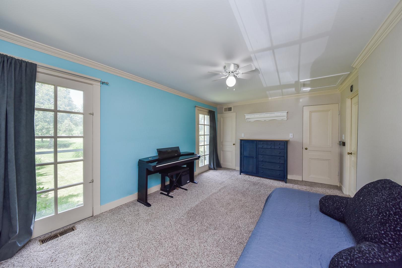 27W355 Mack Road Wheaton, IL 60189 - Photo 18 of 22 a spacious bedroom with a bed dresser and a window