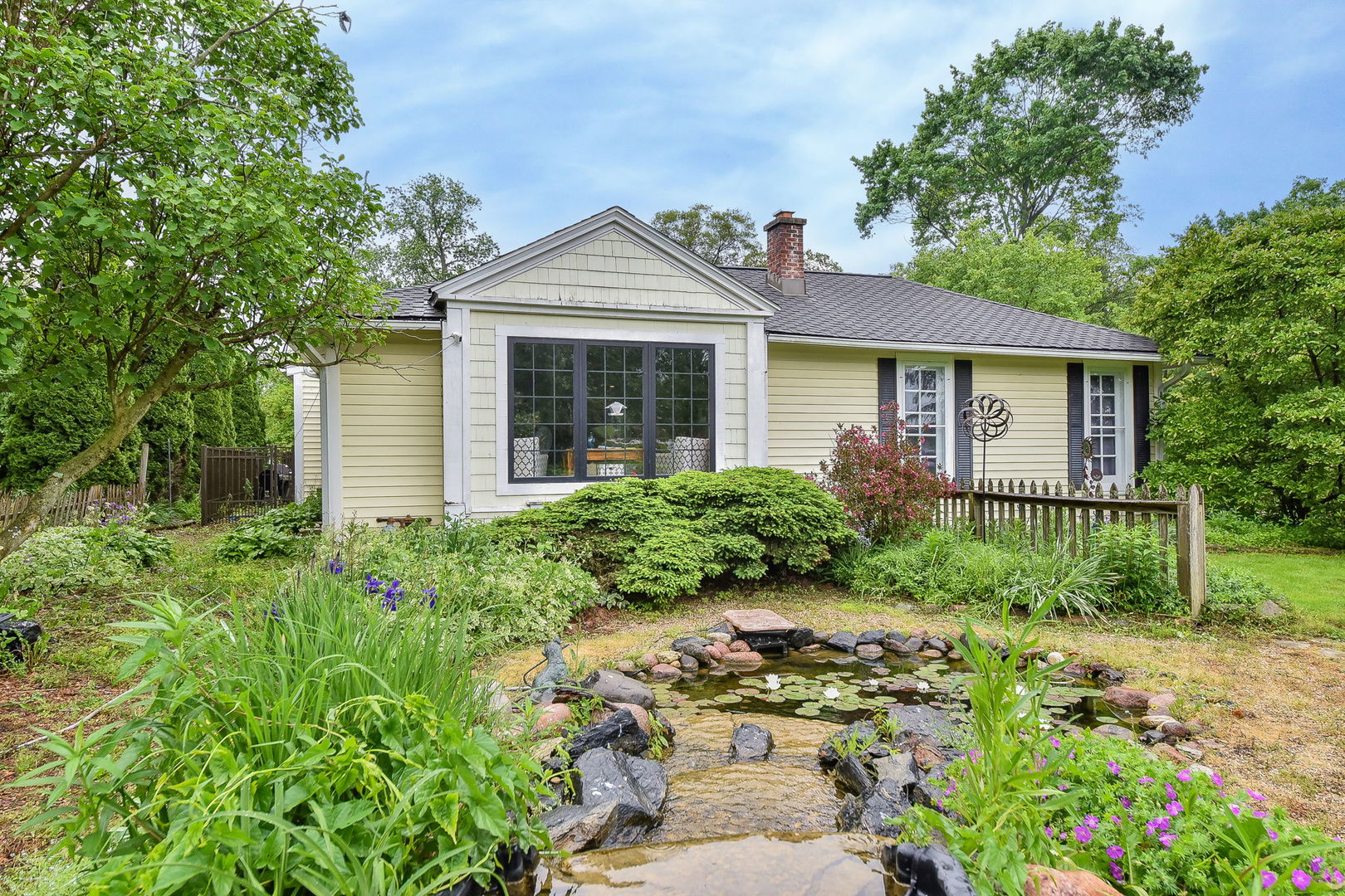 27W355 Mack Road Wheaton, IL 60189 - Photo 2 of 22 a front view of a house with a yard
