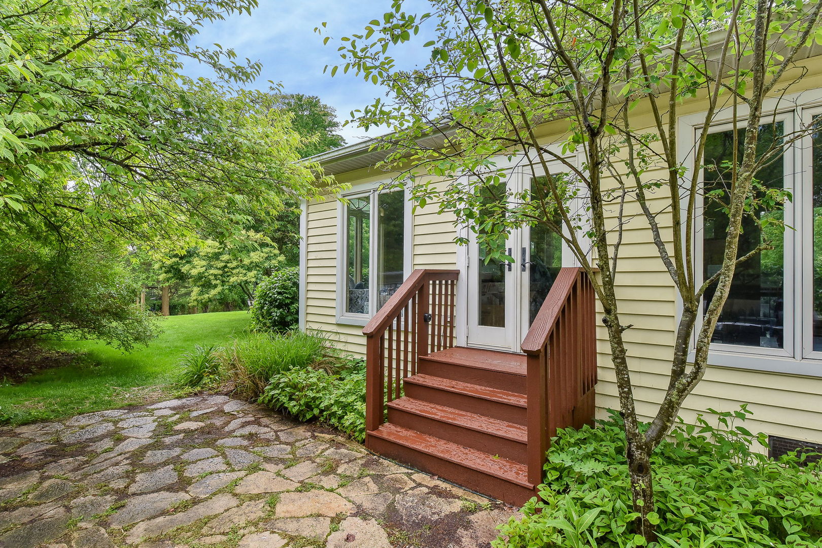 27W355 Mack Road Wheaton, IL 60189 - Photo 4 of 22 a view of a house with backyard and wooden fence