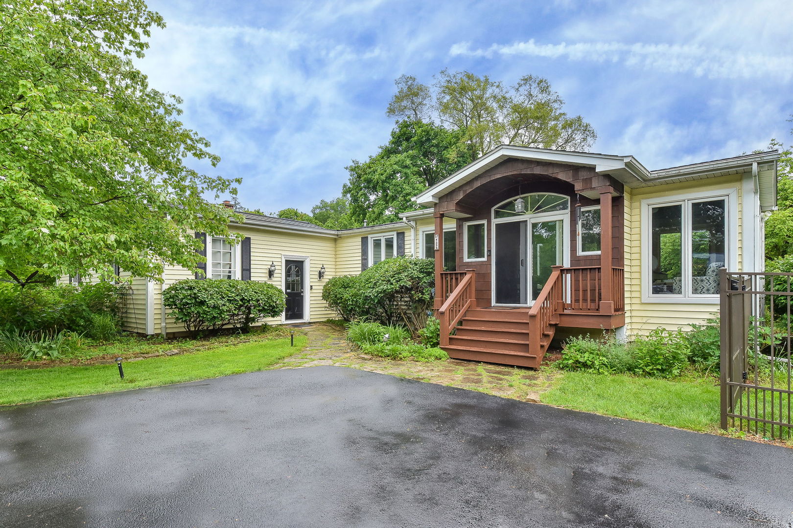 27W355 Mack Road Wheaton, IL 60189 - Photo 5 of 22 a front view of a house with a yard and porch