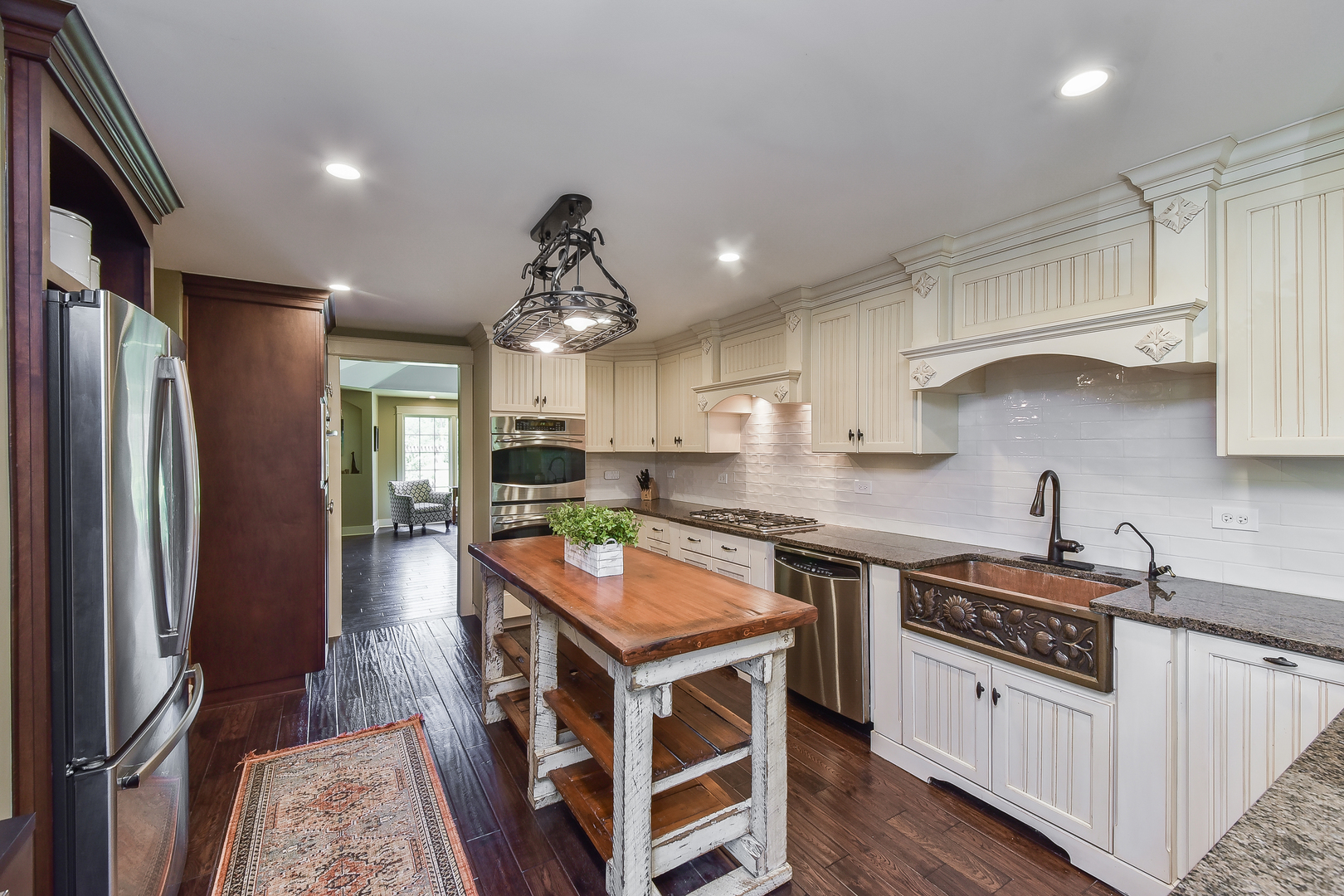27W355 Mack Road Wheaton, IL 60189 - Photo 9 of 22 a kitchen with stainless steel appliances granite countertop a stove refrigerator and cabinets