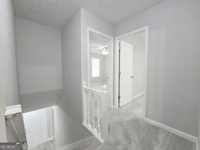 a bathroom with a glass door shower