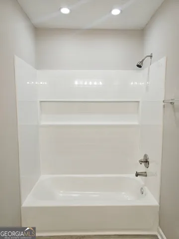 a bathroom with bathtub