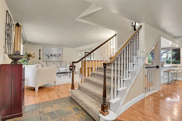 a view of entryway and hall with wooden floor