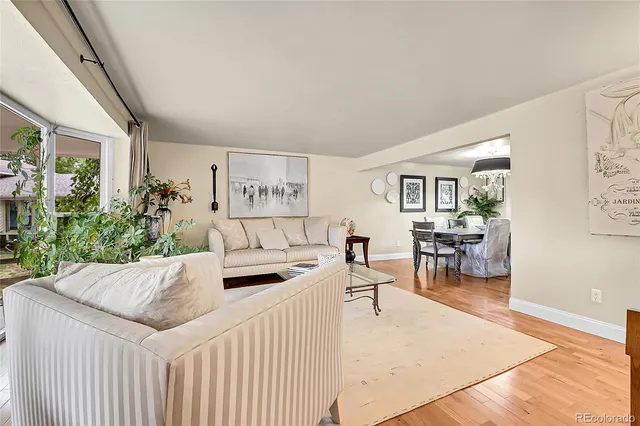 a living room with furniture and a table