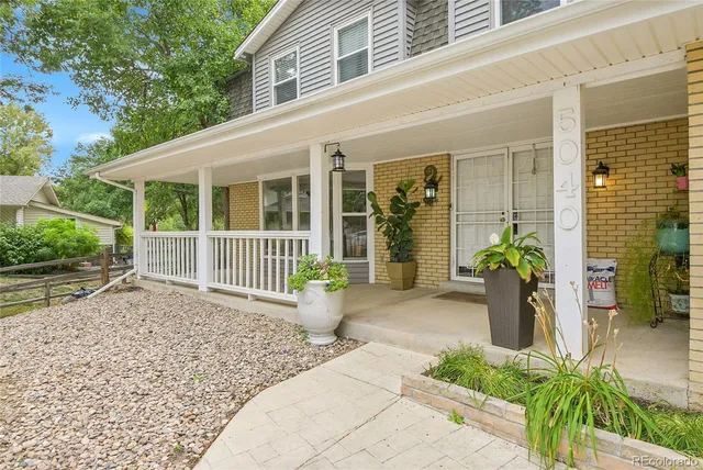 a front view of a house with a porch