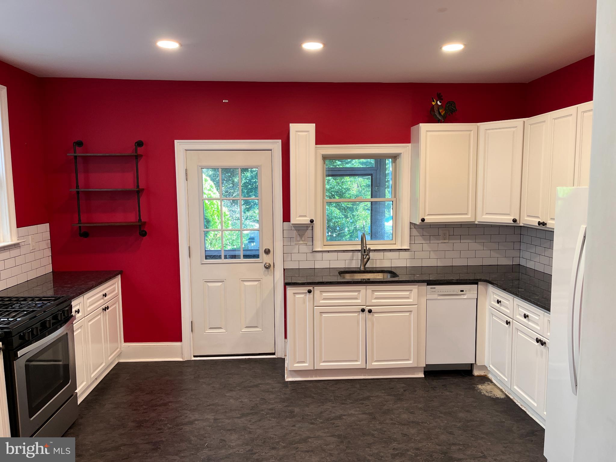 256 Chestnut Street Spring City, PA 19475 - Photo 2 of 12 a kitchen that has a sink and a stove in it