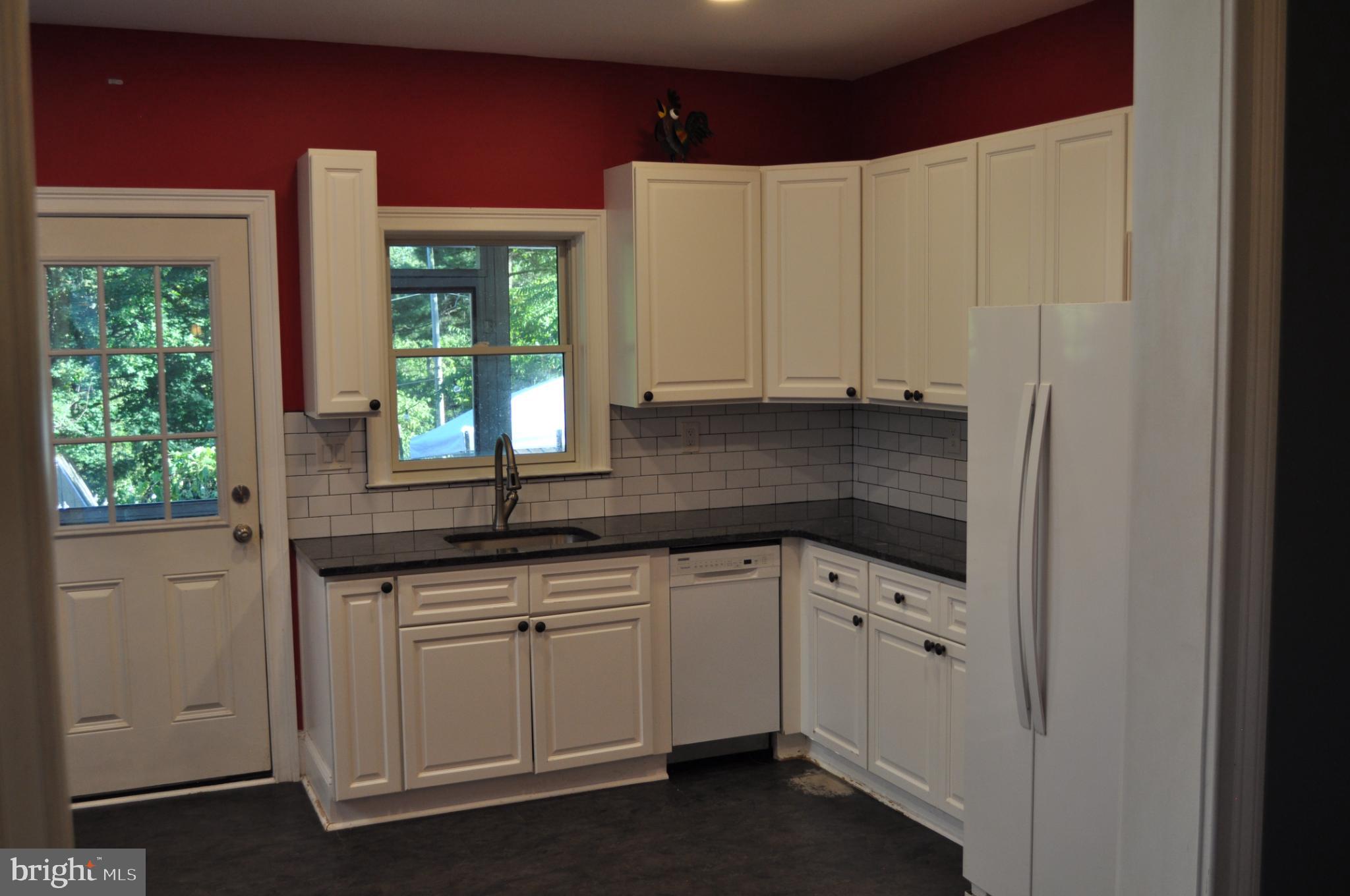 256 Chestnut Street Spring City, PA 19475 - Photo 3 of 12 a kitchen with a sink and cabinets