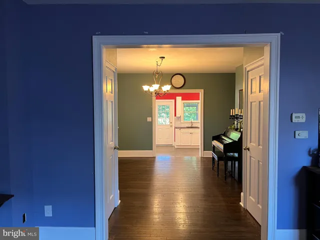 a view of interior space with wooden floor and furniture