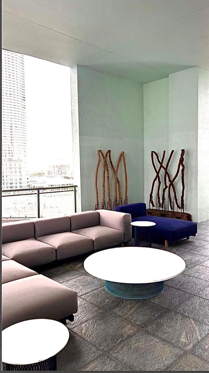 90 Southwest 3rd Street, Unit 3112 Miami, FL 33130 - Photo 18 of 42 a living room with furniture and a large window