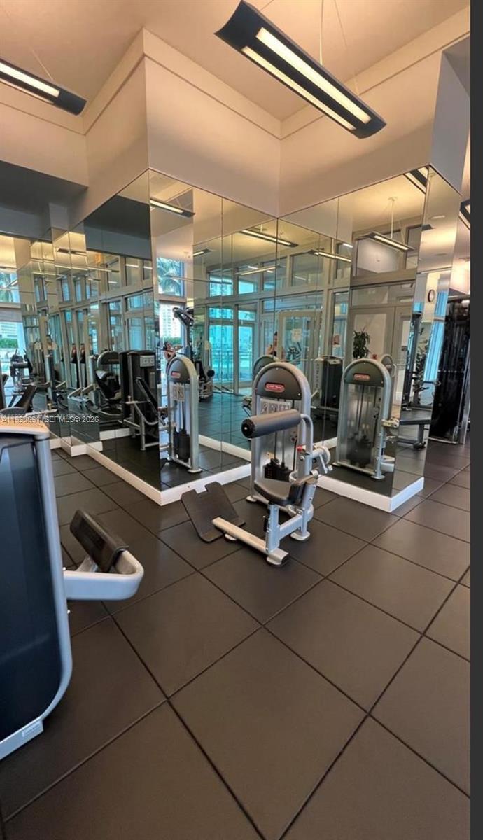 90 Southwest 3rd Street, Unit 3112 Miami, FL 33130 - Photo 21 of 42 a room with gym equipment