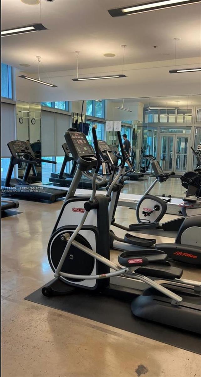 90 Southwest 3rd Street, Unit 3112 Miami, FL 33130 - Photo 23 of 43 a view of a room with gym equipment