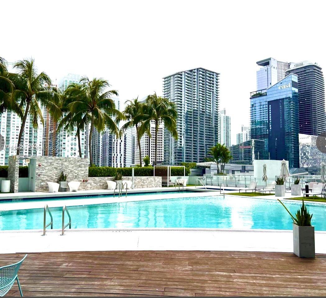 90 Southwest 3rd Street, Unit 3112 Miami, FL 33130 - Photo 28 of 42 a view of a swimming pool with a yard