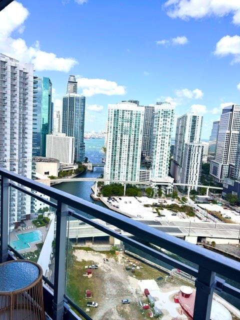 90 Southwest 3rd Street, Unit 3112 Miami, FL 33130 - Photo 3 of 42 a view of swimming pool from a balcony