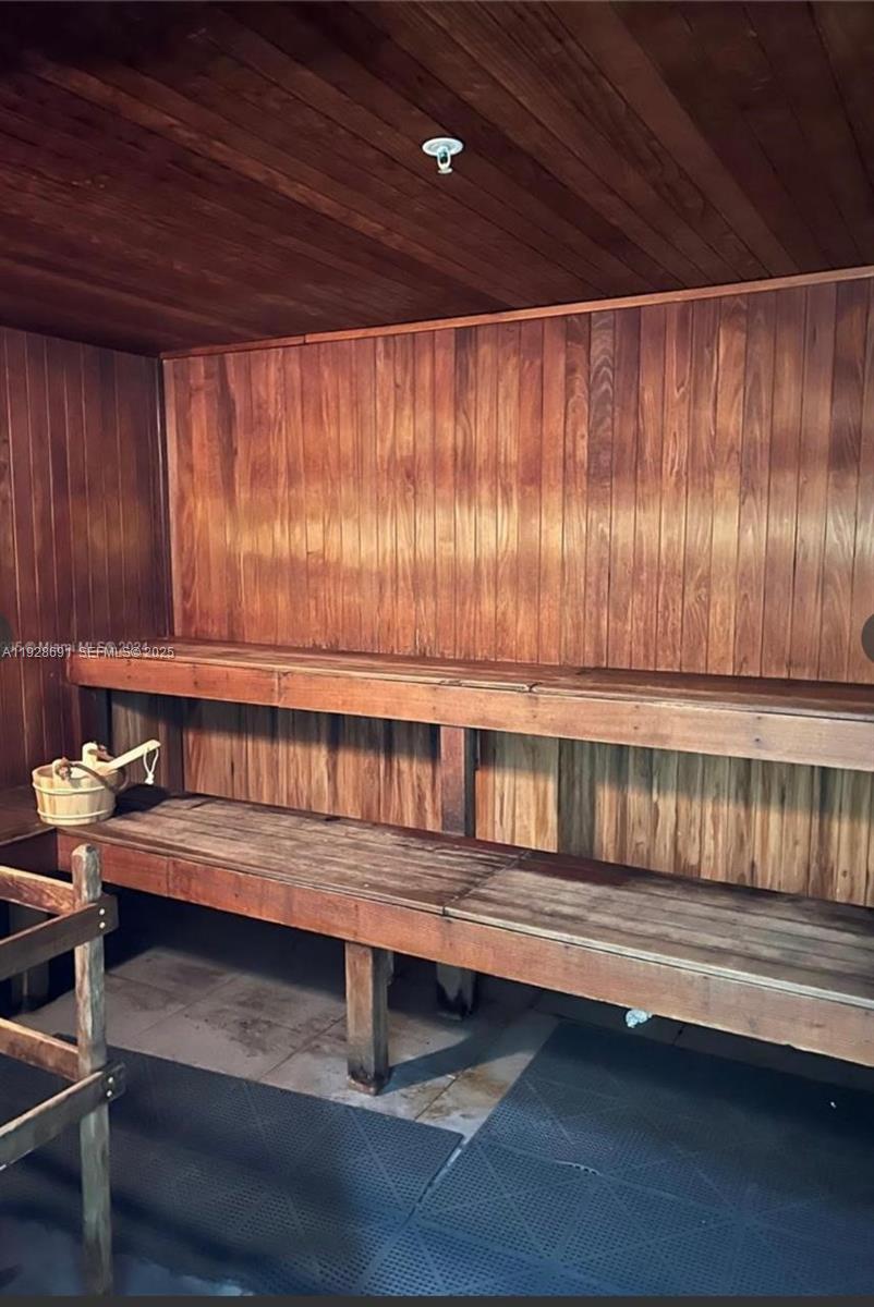 90 Southwest 3rd Street, Unit 3112 Miami, FL 33130 - Photo 39 of 43 a reading room with furniture and wooden floor