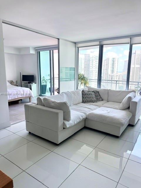 90 Southwest 3rd Street, Unit 3112 Miami, FL 33130 - Photo 5 of 43 a living room with furniture and a large window