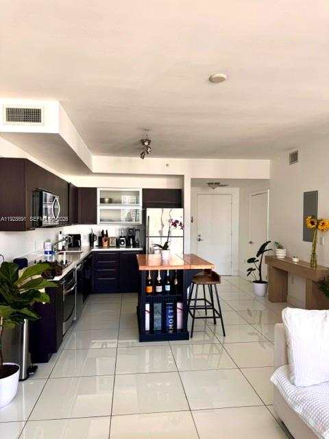 90 Southwest 3rd Street, Unit 3112 Miami, FL 33130 - Photo 6 of 42 a kitchen with a dining table and chairs