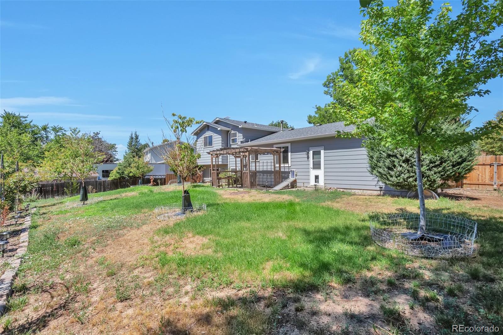14808 East Tufts Avenue Aurora, CO 80015 - Photo 23 of 25 a house view with a garden space