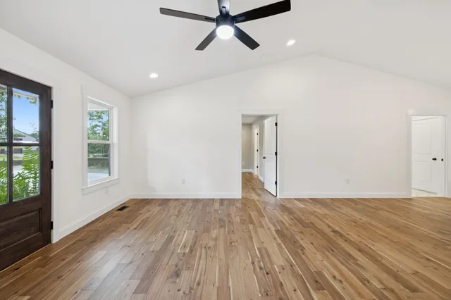 a kitchen with stainless steel appliances granite countertop a sink a stove and cabinets