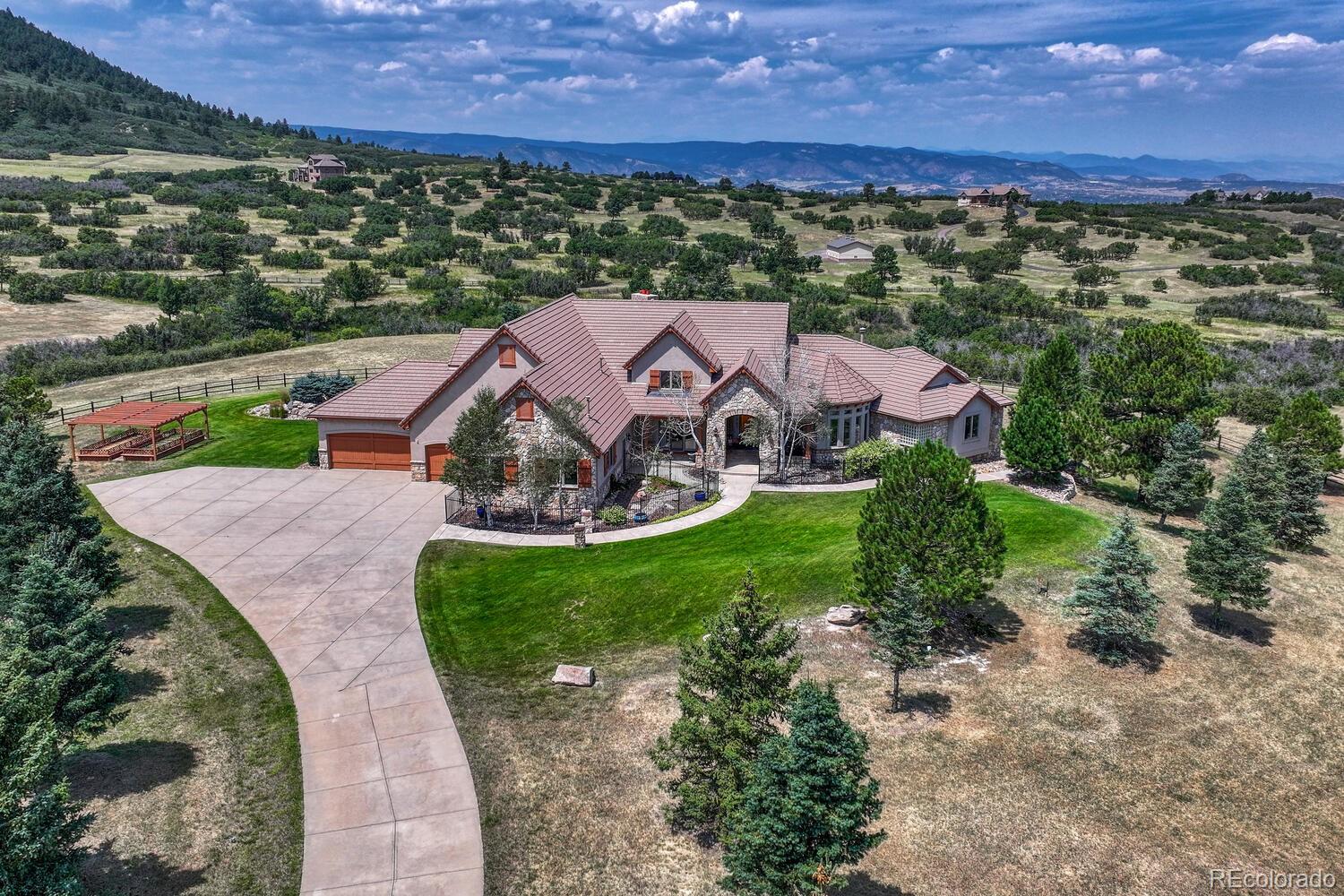 an aerial view of a house with a garden