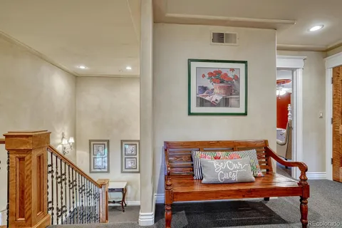 a living room with furniture and a painting