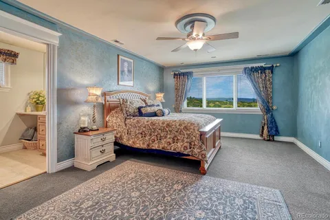 a bedroom with bed and window