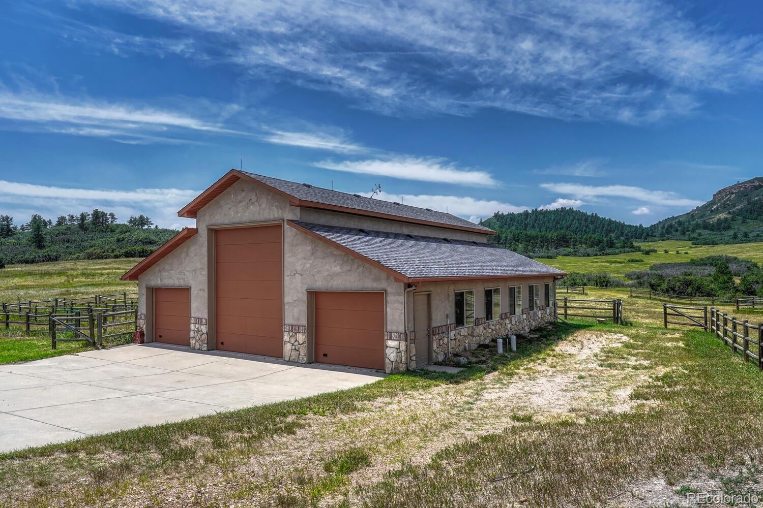 3851 Castle Butte Drive Castle Rock, CO 80109 - Photo 45 of 50 a view of a house with a yard balcony and wooden fence