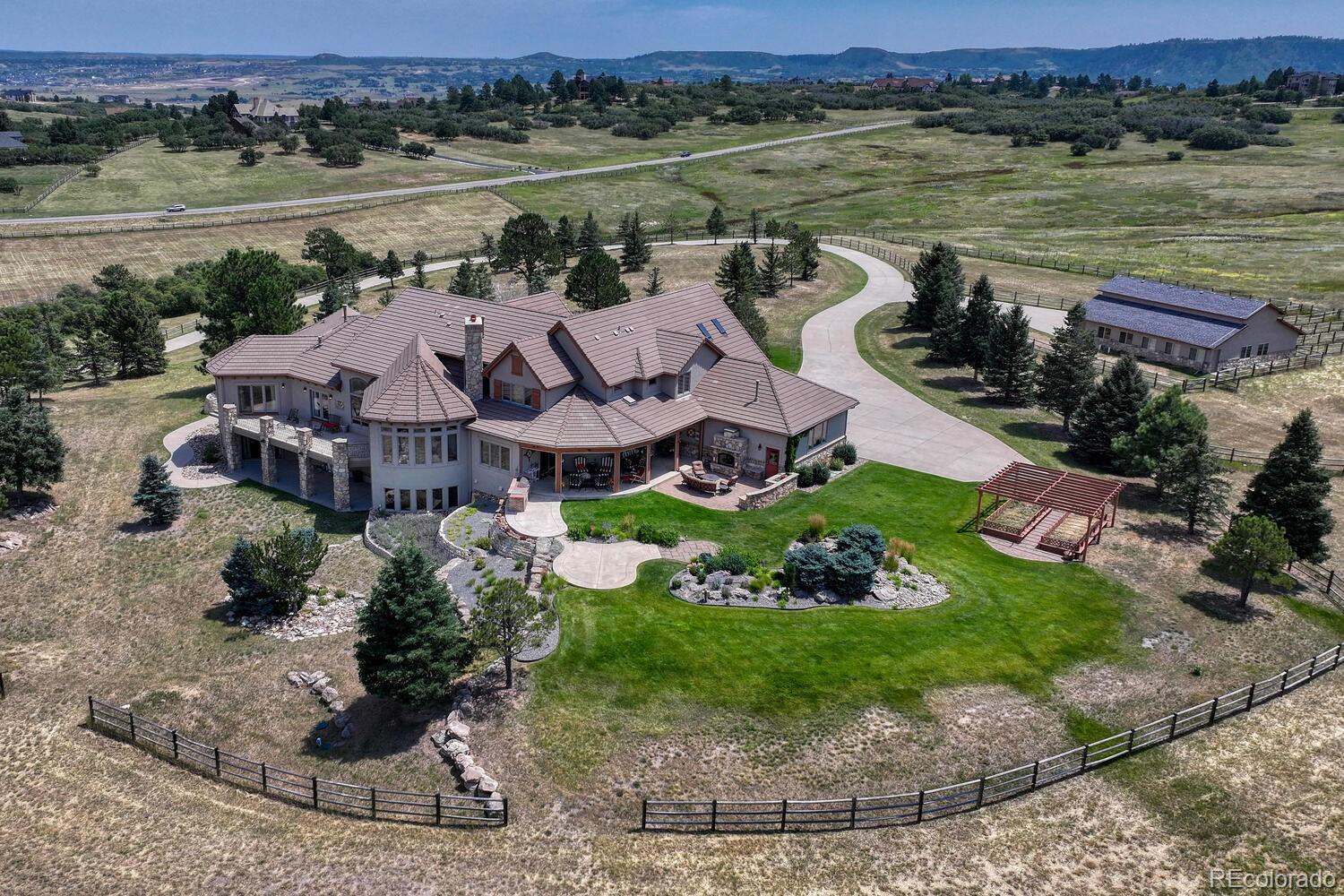 3851 Castle Butte Drive Castle Rock, CO 80109 - Photo 47 of 50 a view of a lake with a mountain in the background