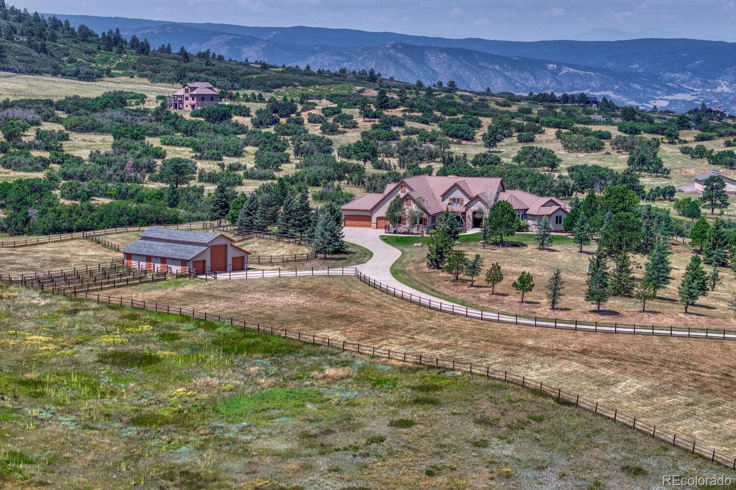 3851 Castle Butte Drive Castle Rock, CO 80109 - Photo 49 of 50 an aerial view of residential houses and outdoor space