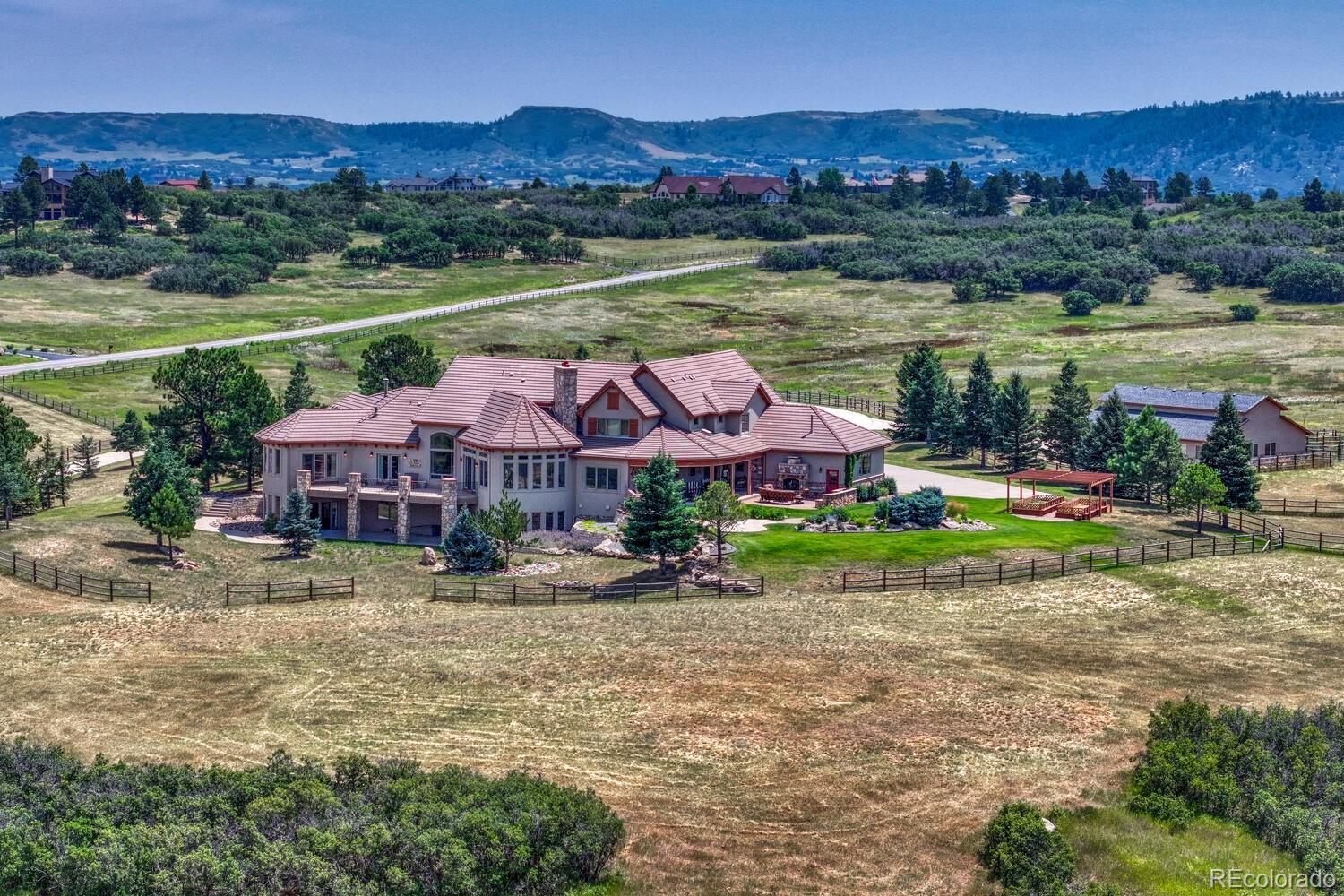 3851 Castle Butte Drive Castle Rock, CO 80109 - Photo 50 of 50 an aerial view of a house with big yard