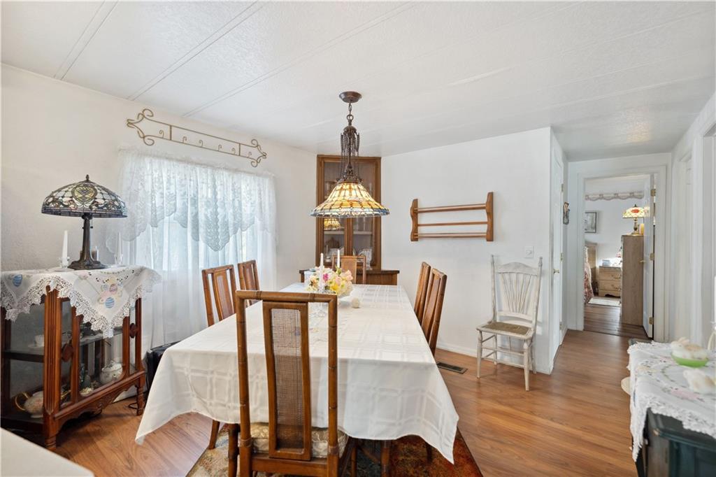 476 Cecil-Henderson Road Cecil, PA 15321 - Photo 14 of 37 a view of a dining room with furniture window and wooden floor
