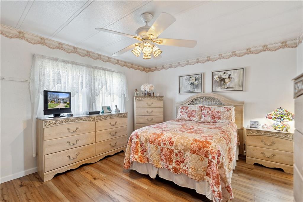 476 Cecil-Henderson Road Cecil, PA 15321 - Photo 16 of 37 a bedroom with a bed and a tv on the dresser