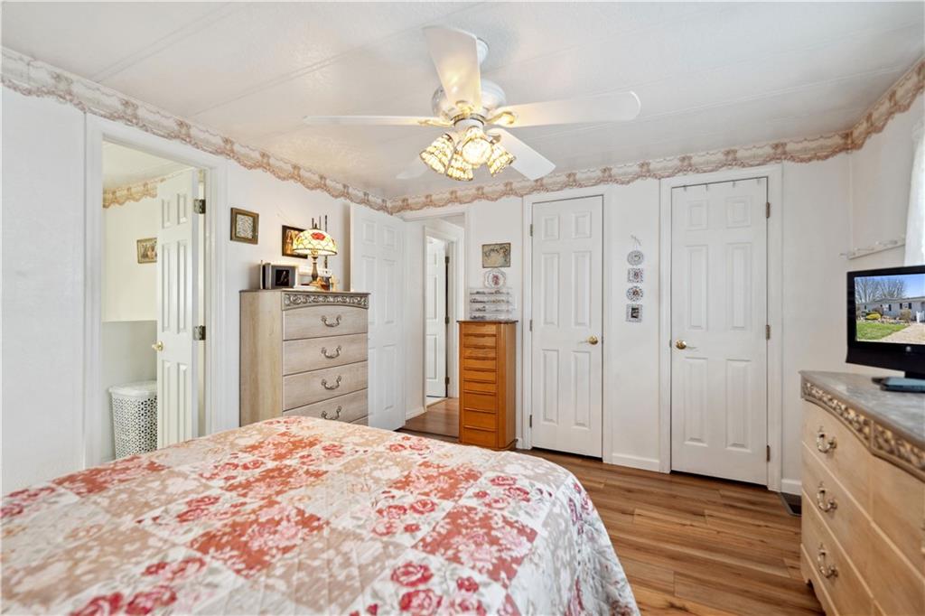 476 Cecil-Henderson Road Cecil, PA 15321 - Photo 17 of 37 a bedroom with a bed and a chandelier