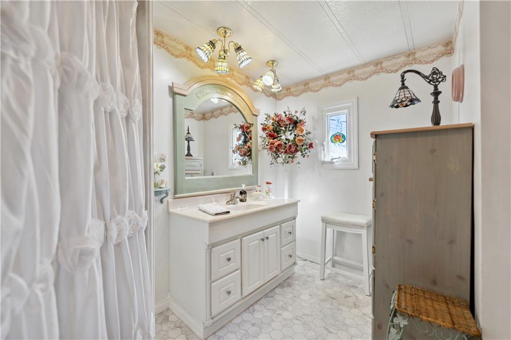 476 Cecil-Henderson Road Cecil, PA 15321 - Photo 18 of 37 a spacious bathroom with a double vanity sink and a mirror