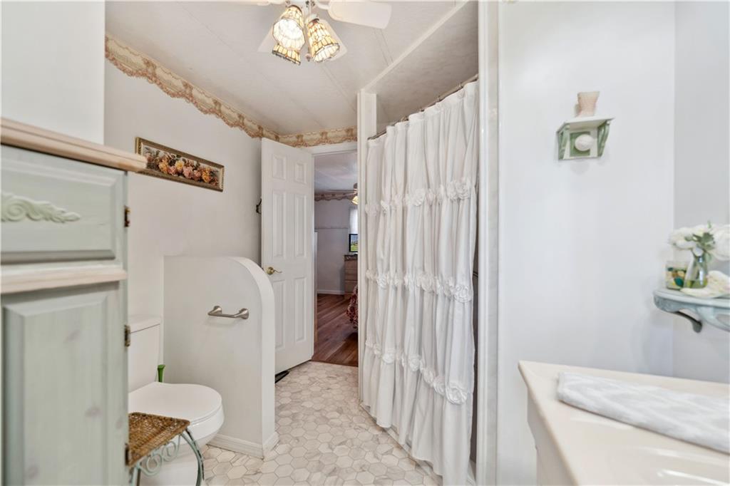 476 Cecil-Henderson Road Cecil, PA 15321 - Photo 19 of 37 a bathroom with a sink toilet and shower