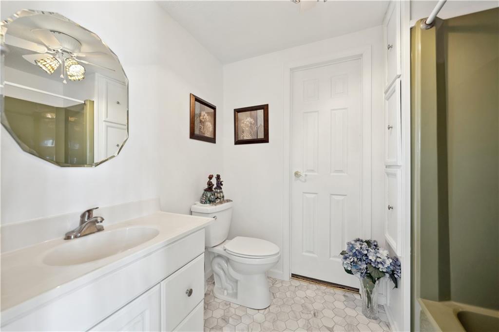 476 Cecil-Henderson Road Cecil, PA 15321 - Photo 22 of 37 a bathroom with a toilet sink and mirror